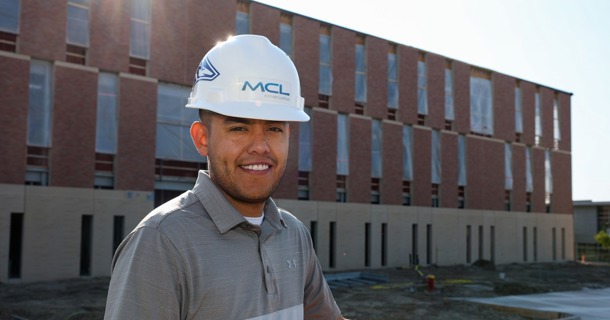 UNK graduate David Almanza is a project manager with MCL Construction. He’s part of the team building the $95 million Rural Health Education Building on campus. (Photo by Erika Pritchard, UNK Communications)